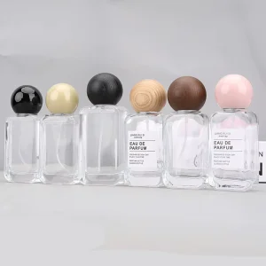 35ml 50ml Transparent Glass Perfume Spray Bottle with Screen Printing and Ball Cap