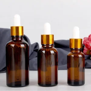 5ml 10ml 15ml 30ml 100ml Round Amber Glass Serum and Essential Oil Dropper Bottle with Gold Pipette