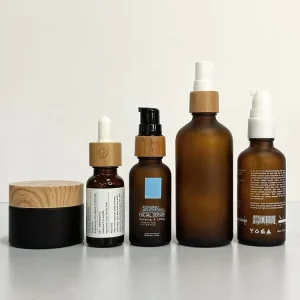 Amber Frosted Glass Bottle and Cream Jar with Bamboo and Plastic Dropper Pump Cap for Essential Oil and Cosmetic Packaging