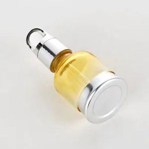 Clear Glass Yellow Oil Bottle with Flip-Top Silver Cap for Hair and Body Oil