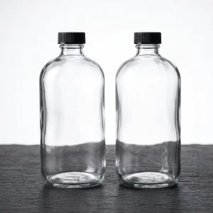 Clear Round Glass Boston Bottles for Juice, Syrup, and Coffee with Black Screw Cap