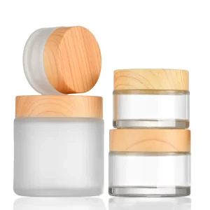Custom Lidded Frosted Black Glass Jars with Wooden Lid Cosmetic Containers for Face Cream (5g 100g) in Stock