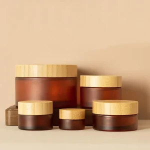 Customizable Frosted Amber Walnut Glass Cream Jar with Bamboo Lid for Cosmetic Packaging