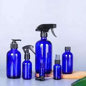 Empty Blue Color Refillable Glass 250 ml 500 ml Boston Round Glass Spray Bottle With Adjustable Spray Lid