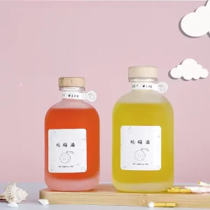 Empty Heavy Glass Beverage Bottle 250ml 350ml 500ml Clear Frosted Round Customized Liquor Bottle with Cork Stopper