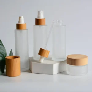 Frosted Glass Cosmetic Packaging Set with Spray, Lotion, Roller, and Dropper Bottles with Bamboo Lids