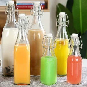 Manufacturer Supply Transparent Glass Bottles 250ml 500ml 750ml Glass Beverage Bottles with Snap Airtight Caps for Milk Wine