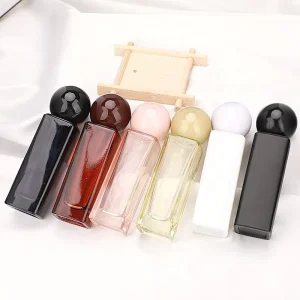OEM Factory Square Colored Crystal 30ml Refillable Perfume Glass Bottle with Screw Pump Sprayer for Cosmetic Packaging