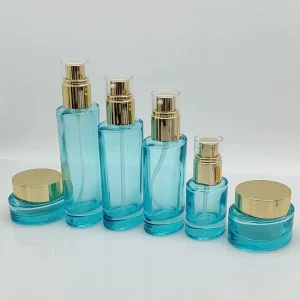 Premium Sky Blue Glass Skincare Packaging Set Gold Spray Pump Cosmetic Bottle and Jar for Face Cream