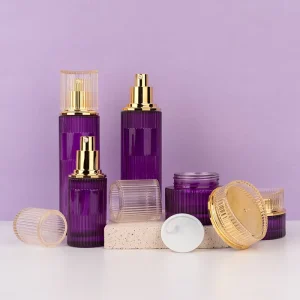 Purple Cosmetics Packaging Set with Glass Skin Care Container, Glossy Gold Lotion Pump, Screw Cap, and Glass Jar