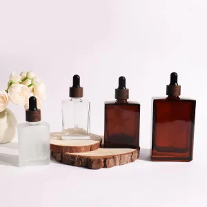Refillable 30ml Transparent Frosted Square Empty Customize Amber Glass Serum Oil Dropper Bottles With Dark Plastic Wood Lids