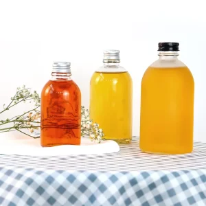 Reusable 300 ml 500 ml Clear Flint Round Glass Beverage Bottles with Screw Top for Soda and Carbonated Drinks