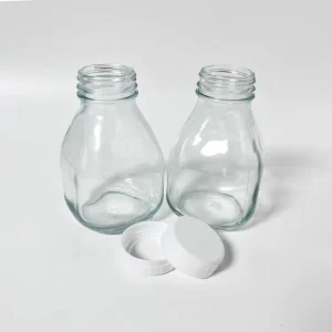 Squat Short Glass Milk Bottle with Plastic Caps for Milk Juice Coffee Tea Beverages and Energy Drinks