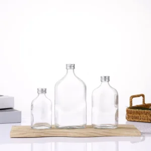 Transparent Flat Round 50ml 100ml 250ml Liquor Bottles with Aluminum Cap for Brandy Gin Rum Vodka and Tequila
