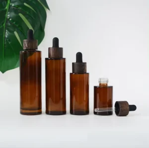 Wholesales 20 30 50 60 80 100ml Flat Shoulder Amber Glass Bottle with Dark Wood Lid Essential Oil Serum Dropper Bottles